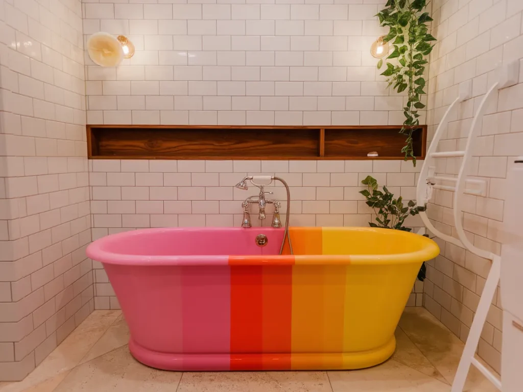 Brightly painted tub showcasing painted surfaces and colors for bathtub painting ideas.