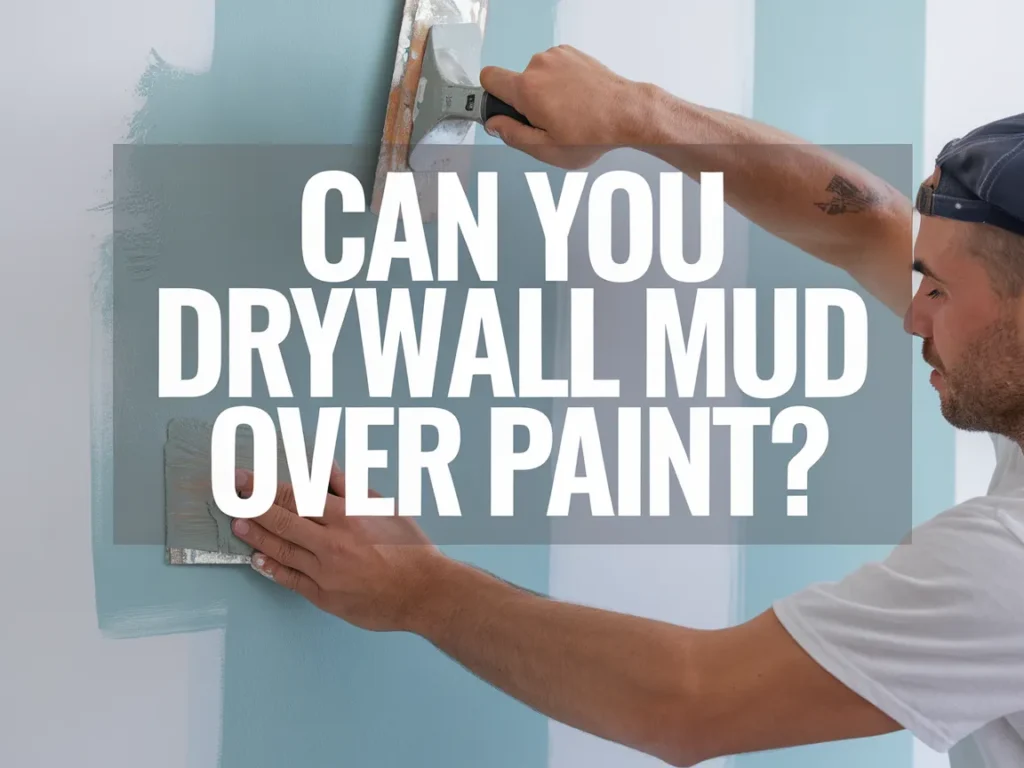 Person applying drywall mud over painted wall, demonstrating drywall techniques.