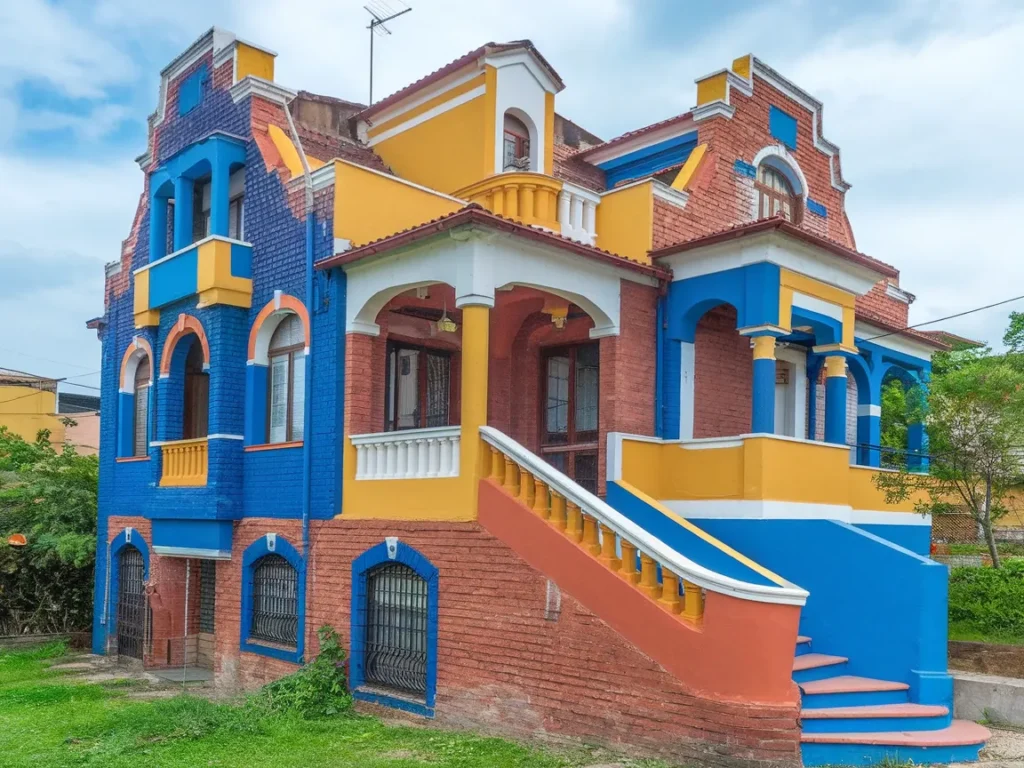 Colorfully painted brick home showcasing vibrant exterior painting options.