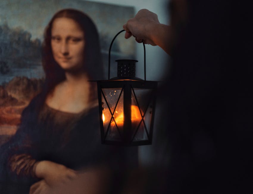 Atmospheric image of the Mona Lisa with a lantern casting a warm glow.